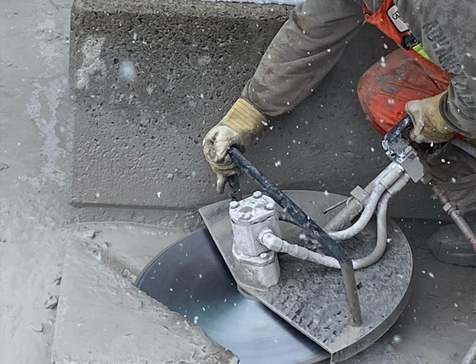 Hand saw cutting concrete wall